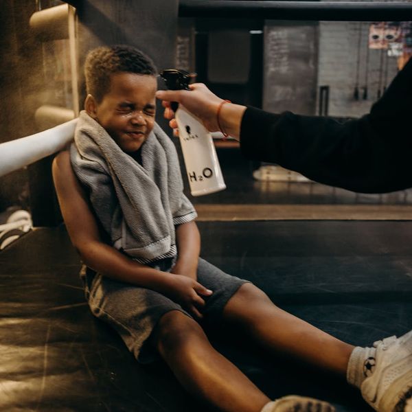 Water bottle and towel in a gym setting